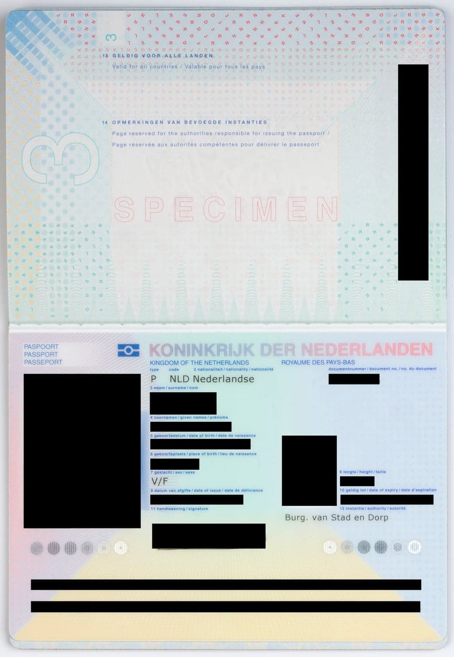 Dutch passport specimen after names, dates, and photos are blacked out